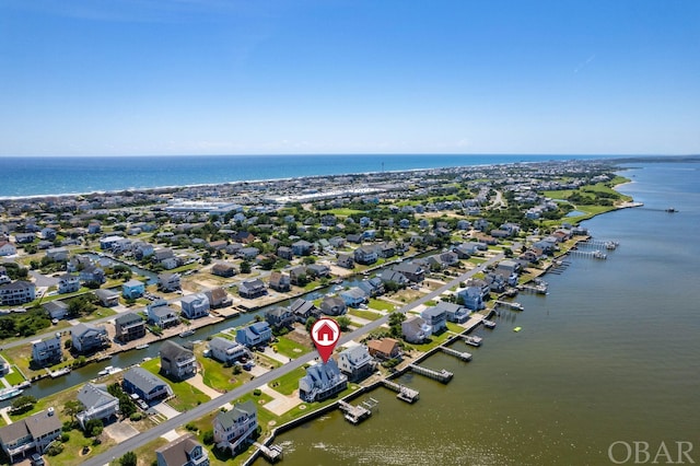 birds eye view of property with a residential view and a water view