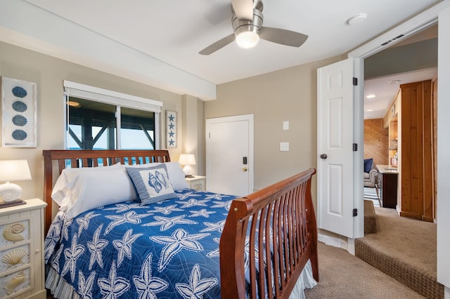 carpeted bedroom featuring ceiling fan