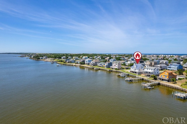 birds eye view of property with a water view and a residential view