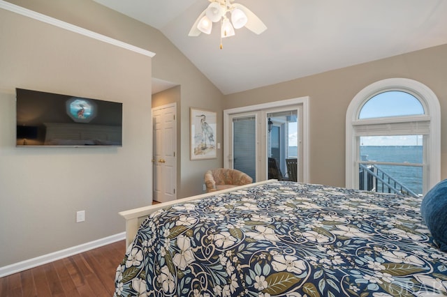 bedroom featuring dark wood-style flooring, a water view, a ceiling fan, baseboards, and vaulted ceiling