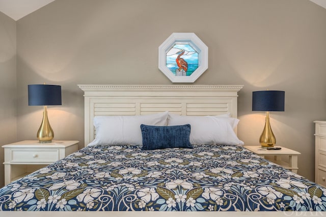 bedroom featuring lofted ceiling