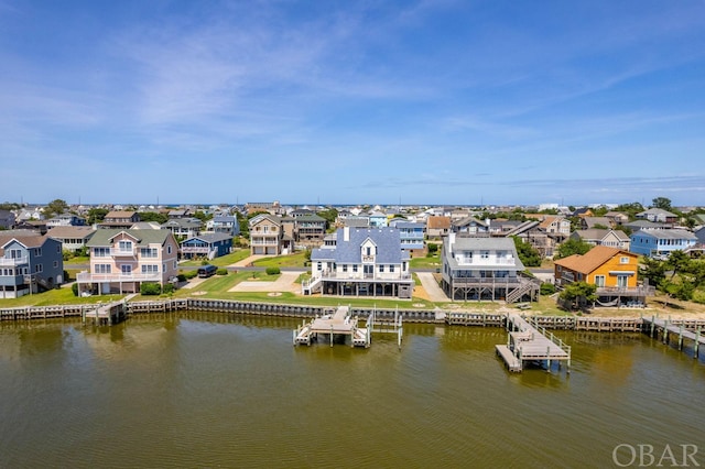 bird's eye view with a water view and a residential view