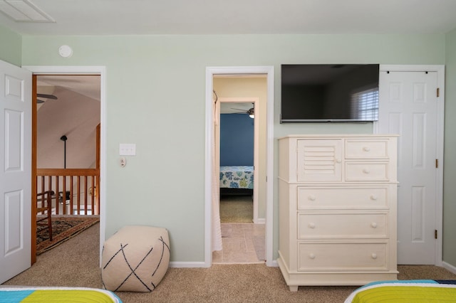carpeted bedroom with visible vents and baseboards