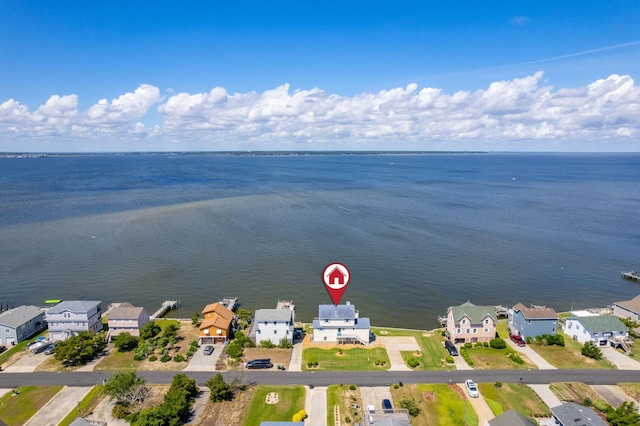 drone / aerial view with a residential view and a water view