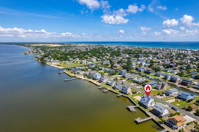 bird's eye view featuring a water view and a residential view