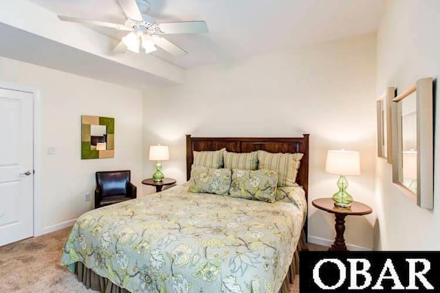 carpeted bedroom with a ceiling fan and baseboards