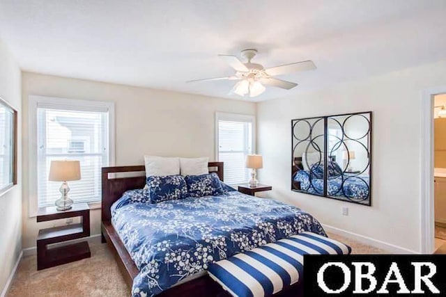 carpeted bedroom featuring baseboards and a ceiling fan