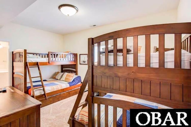 carpeted bedroom with visible vents