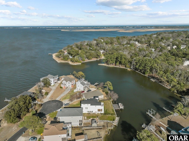 drone / aerial view with a water view and a residential view