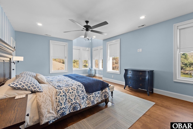 bedroom featuring recessed lighting, visible vents, baseboards, and wood finished floors