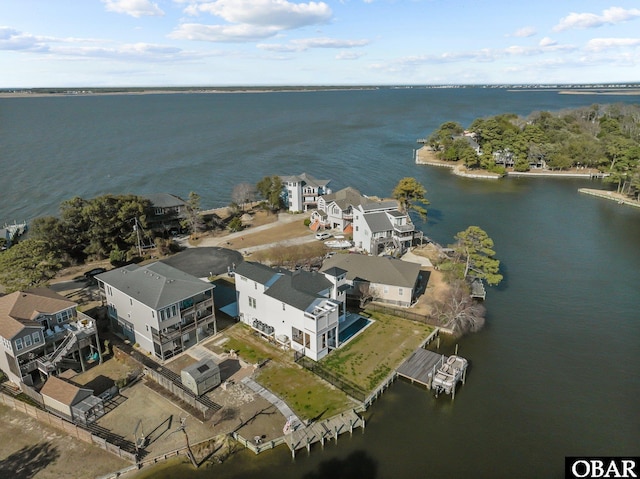 aerial view featuring a residential view and a water view