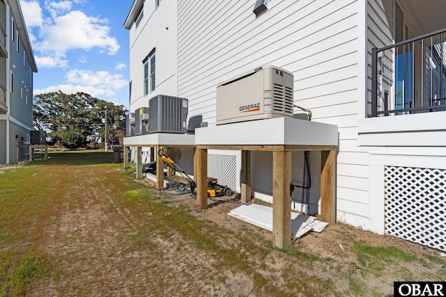 view of side of property featuring central air condition unit