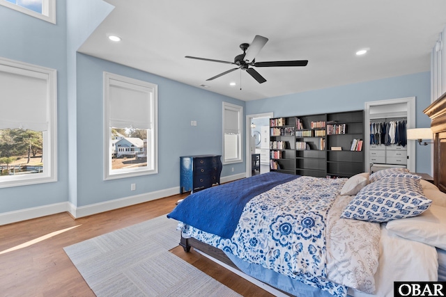 bedroom featuring ceiling fan, baseboards, wood finished floors, and recessed lighting