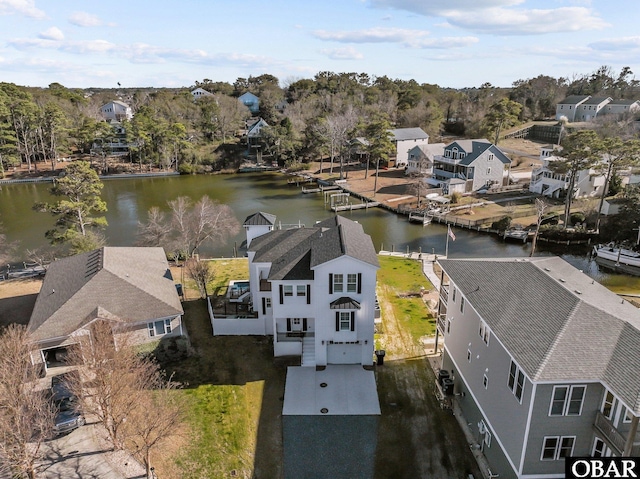 aerial view with a water view and a residential view