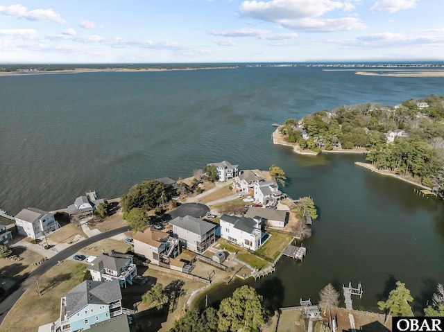 birds eye view of property with a residential view and a water view