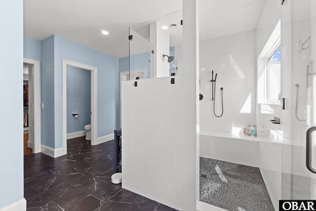 full bathroom featuring marble finish floor, walk in shower, toilet, and baseboards