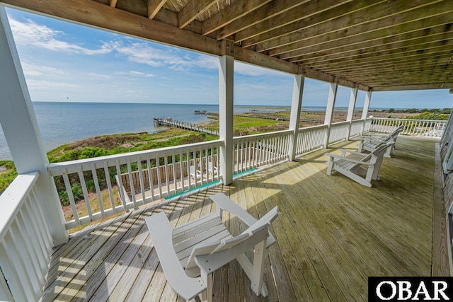 wooden deck with a water view