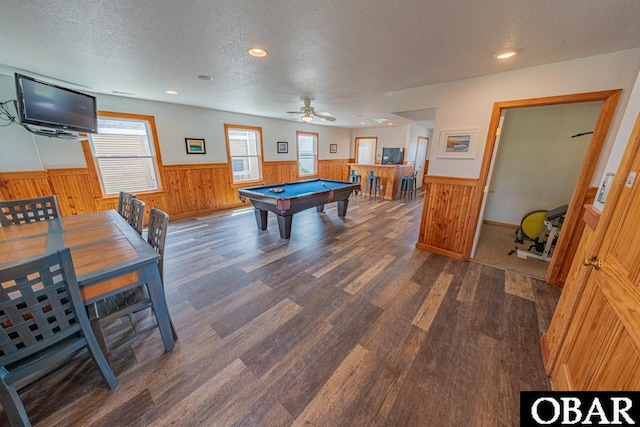 game room featuring a textured ceiling, wood finished floors, pool table, and wainscoting
