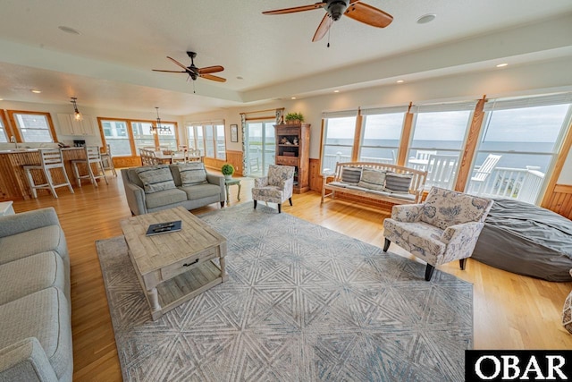 living room with recessed lighting, ceiling fan, wood finished floors, and plenty of natural light