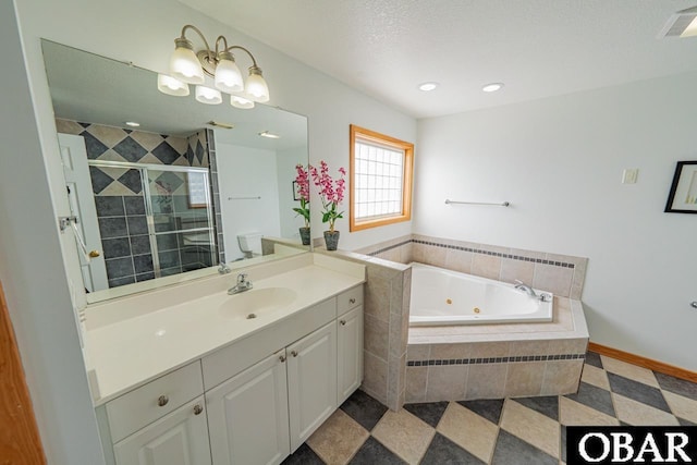 bathroom with visible vents, a stall shower, baseboards, a whirlpool tub, and vanity