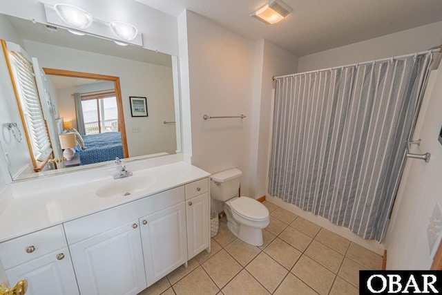 full bathroom featuring curtained shower, connected bathroom, toilet, vanity, and tile patterned flooring