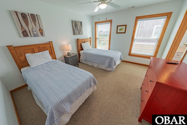 bedroom with carpet, visible vents, ceiling fan, and baseboards