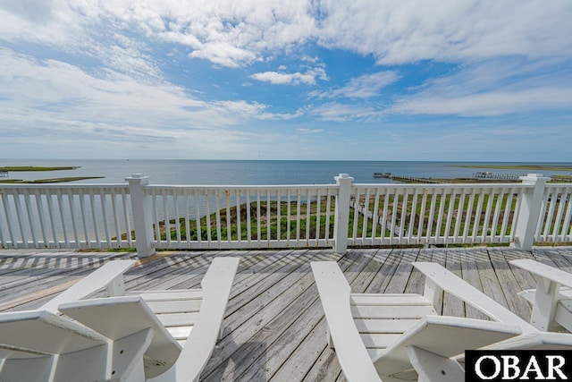 wooden deck featuring a water view