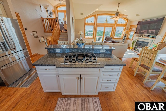 39972 NC-12 Hwy Lot 15, Avon, NC 27915 - kitchen featuring lofted ceiling, a ceiling fan, a glass covered fireplace, and stainless steel fridge with ice dispenser