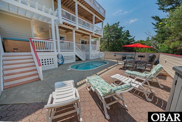 39972 NC-12 Hwy Lot 15, Avon, NC 27915 - view of patio featuring outdoor dining space, an in ground hot tub, and stairs
