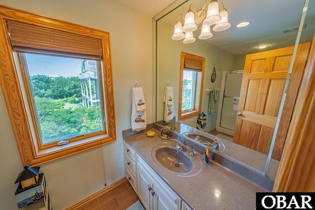 39972 NC-12 Hwy Lot 15, Avon, NC 27915 - full bath with a shower with door, plenty of natural light, wood finished floors, and vanity
