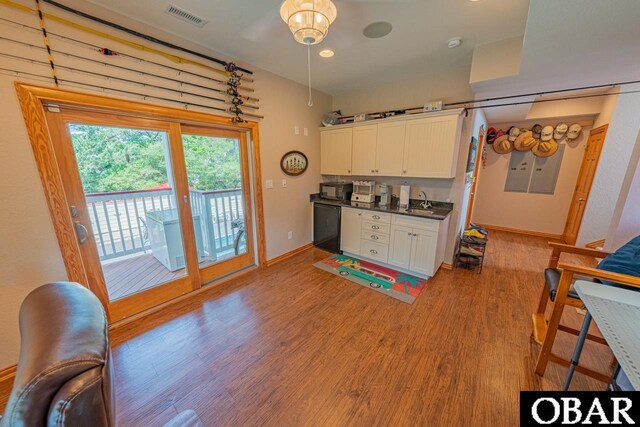 39972 NC-12 Hwy Lot 15, Avon, NC 27915 - kitchen with visible vents, white cabinets, black appliances, and light wood-style flooring