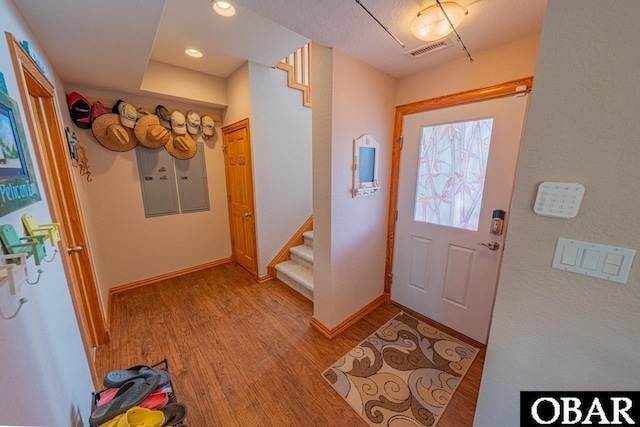 39972 NC-12 Hwy Lot 15, Avon, NC 27915 - foyer entrance with visible vents, baseboards, stairs, and light wood finished floors