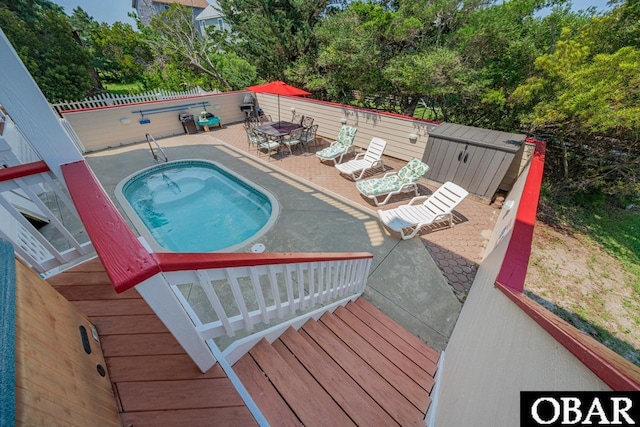 39972 NC-12 Hwy Lot 15, Avon, NC 27915 - view of pool featuring an outbuilding, outdoor dining space, a hot tub, a shed, and a patio area