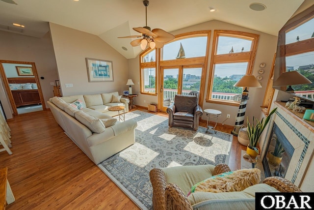 39972 NC-12 Hwy Lot 15, Avon, NC 27915 - living room with lofted ceiling, wood finished floors, a ceiling fan, and a tile fireplace