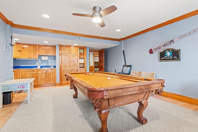 rec room featuring a ceiling fan, baseboards, crown molding, and recessed lighting