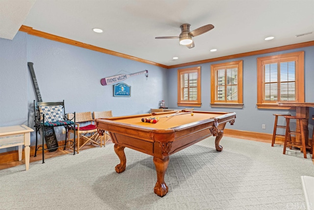 game room featuring light colored carpet, visible vents, ornamental molding, a ceiling fan, and baseboards