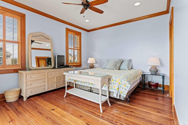 bedroom with light wood-type flooring, baseboards, crown molding, and recessed lighting