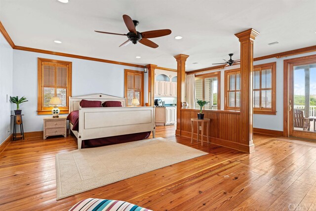 unfurnished bedroom with ornate columns, baseboards, light wood finished floors, and crown molding