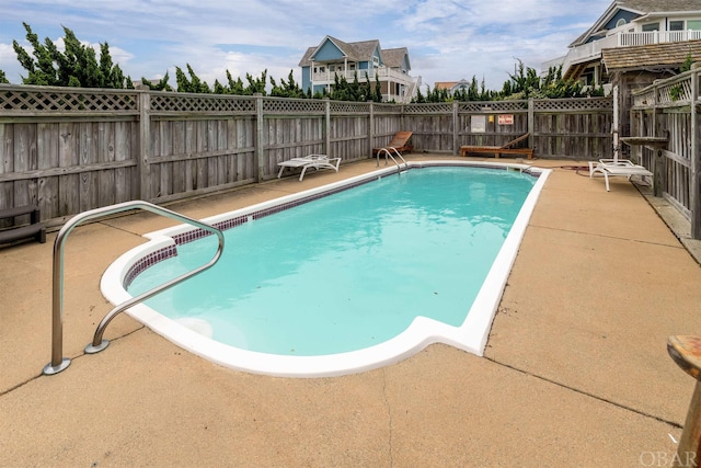 view of pool with a patio, a fenced backyard, and a fenced in pool