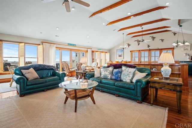 living area with light wood-style floors, high vaulted ceiling, beamed ceiling, and ceiling fan with notable chandelier