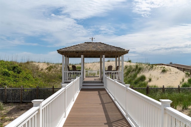 view of community with a gazebo and fence