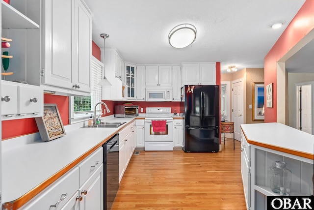 116 Swan View Dr Lot 5, Kill Devil Hills, NC 27948 - kitchen with white appliances, a sink, light countertops, light wood-type flooring, and white cabinetry