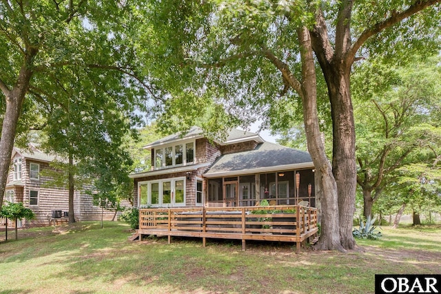 116 Swan View Dr Lot 5, Kill Devil Hills, NC 27948 - back of property with a sunroom, a shingled roof, a deck, and a lawn
