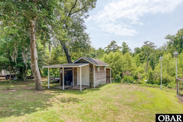 116 Swan View Dr Lot 5, Kill Devil Hills, NC 27948 - view of green lawn with an outbuilding