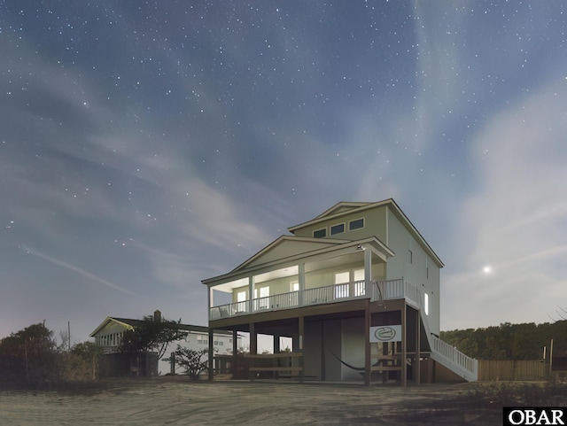 2204 Sandpiper Rd Lot 11, Corolla, NC 27927 - back of house featuring a wooden deck and stairs