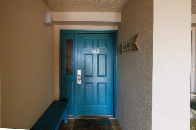 property entrance featuring stucco siding