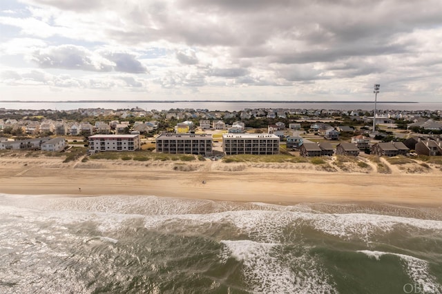 bird's eye view featuring a water view and a view of the beach