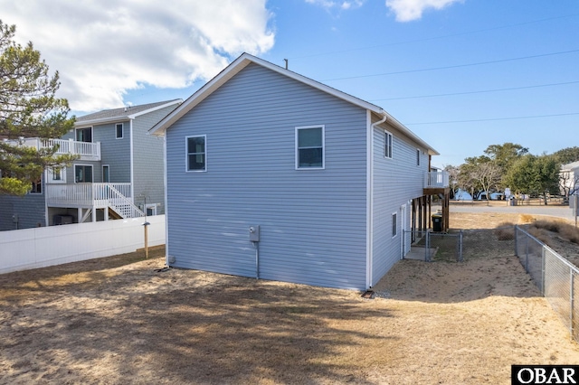 rear view of house with fence