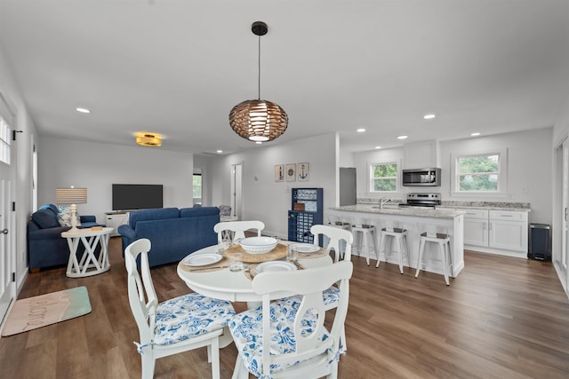 dining room featuring recessed lighting and wood finished floors