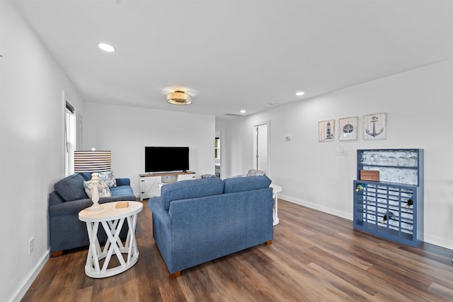 living area featuring dark wood-style floors, baseboards, and recessed lighting